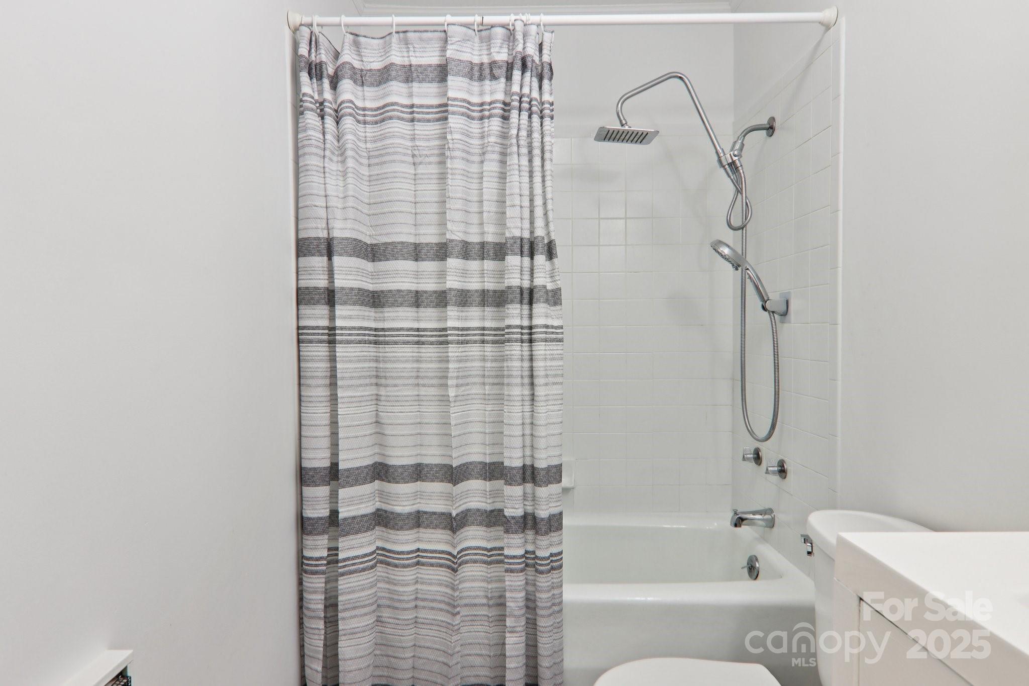 591 Blue Ridge Road Black Mountain, NC 28711 - Photo 14 of 32 a bathroom with a bathtub and shower