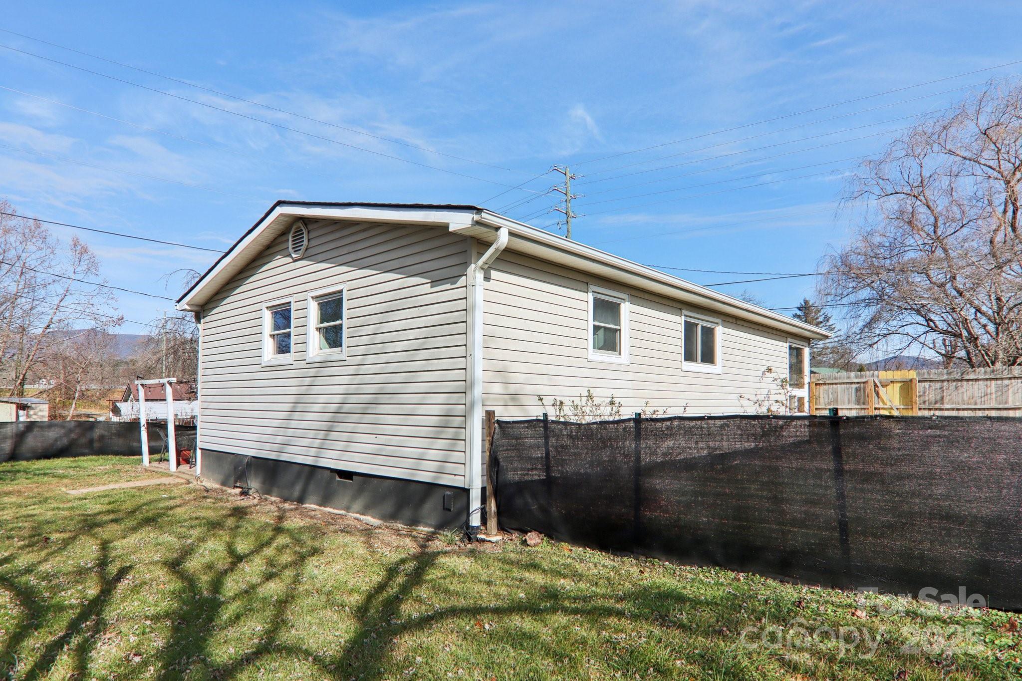 591 Blue Ridge Road Black Mountain, NC 28711 - Photo 29 of 32 a front view of a house with a yard