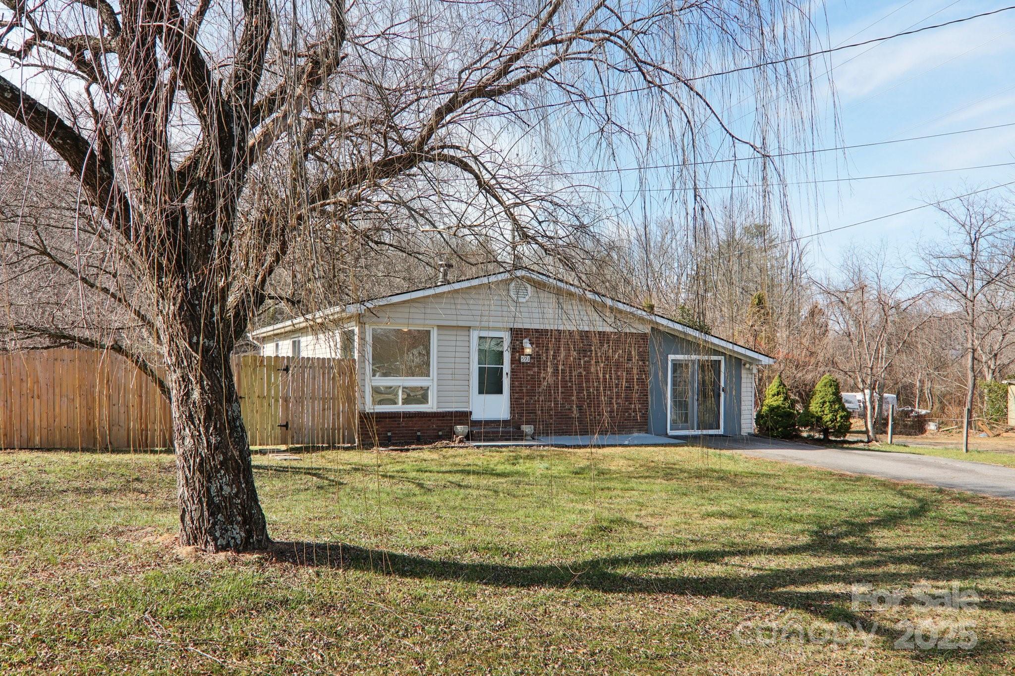 591 Blue Ridge Road Black Mountain, NC 28711 - Photo 7 of 32 a view of a house with a yard