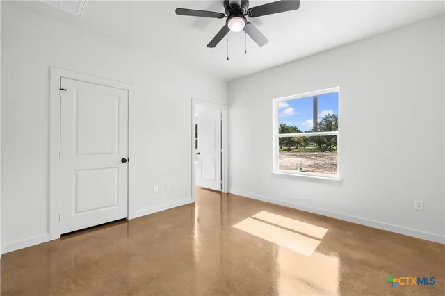 a view of an empty room and window