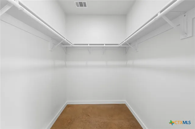 a view of a room with racks on the wall