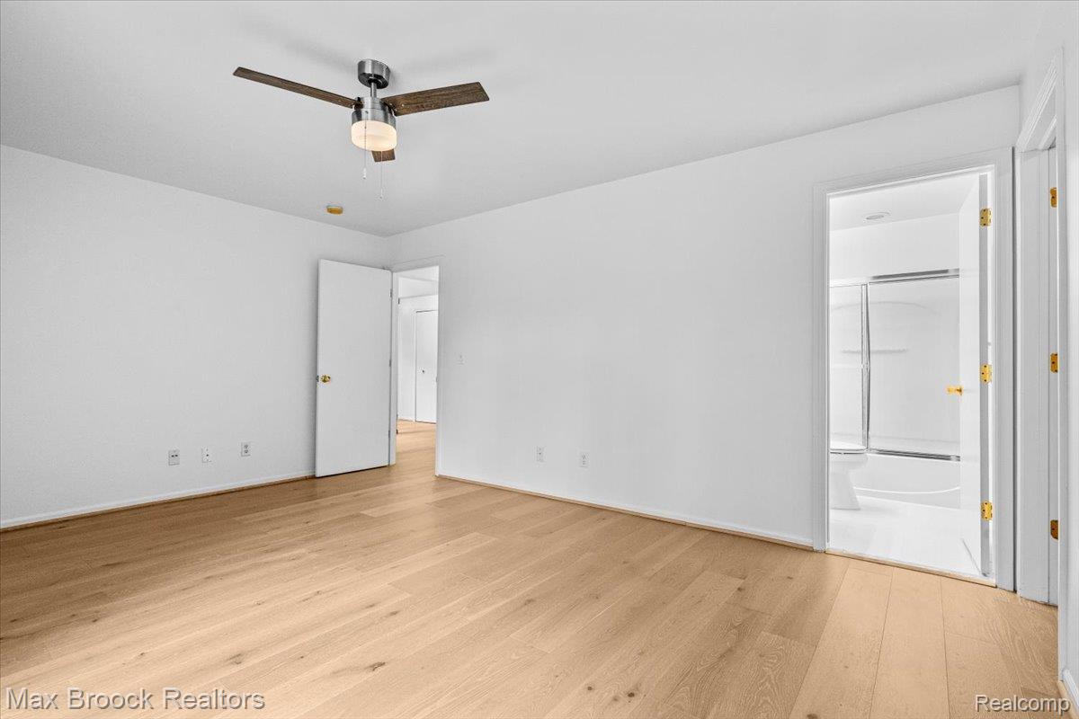 1830 Lone Pine Road Bloomfield Hills, MI 48302 - Photo 50 of 70 Spacious room with light wood-finish flooring, white walls, and a contemporary ceiling fan with integrated lighting
