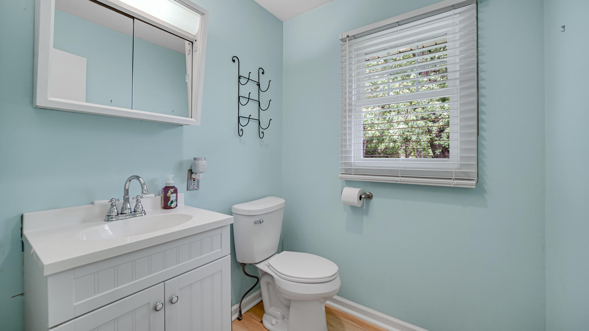 6717 State Rte 49 Rensselaer, IN 47978 - Photo 25 of 31 a white toilet sitting next to a bathroom sink