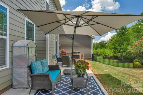 a view of backyard with seating space