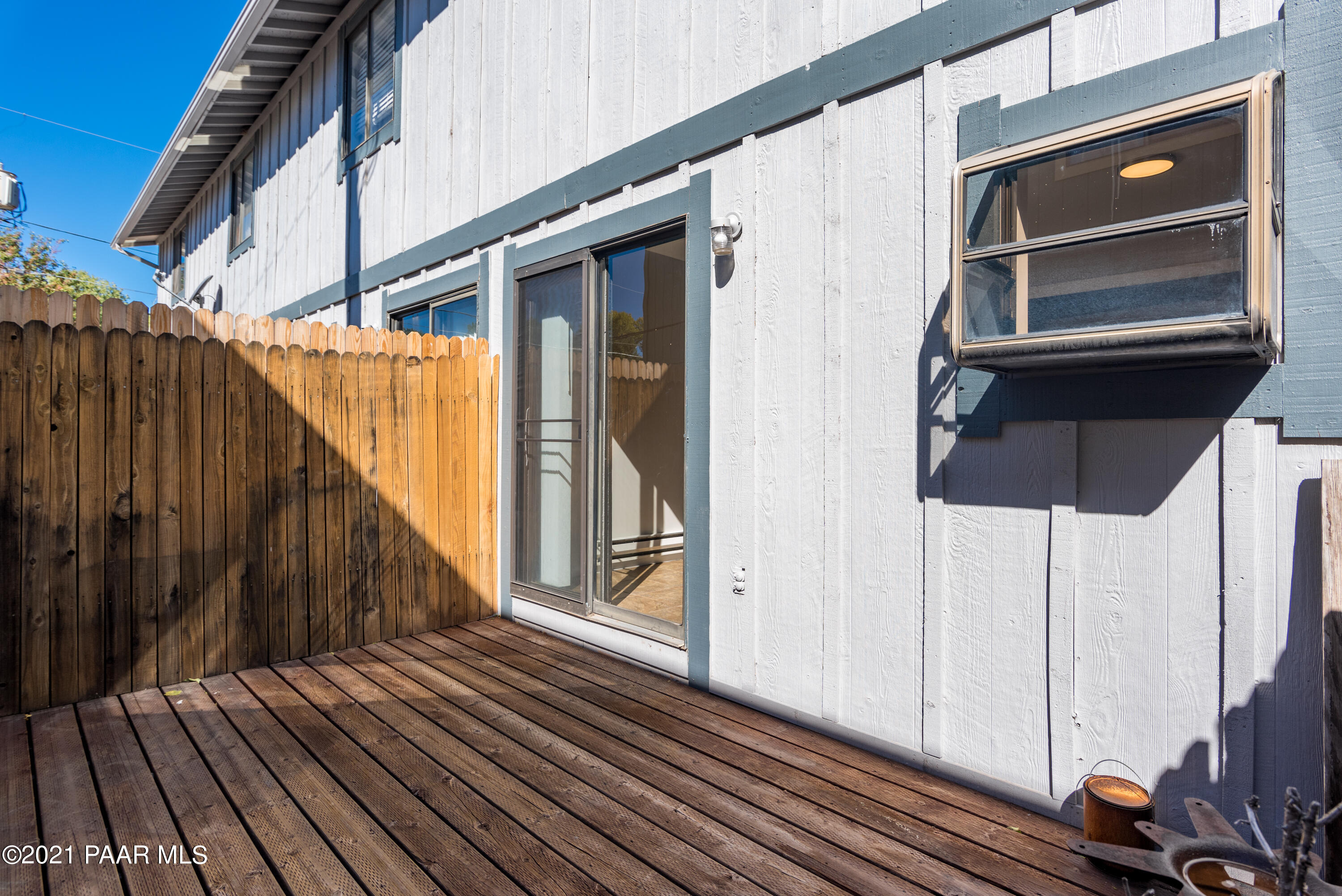 845 Sunset Avenue, Unit D Prescott, AZ 86305 - Photo 11 of 18 a view of a balcony with wooden floor and fence