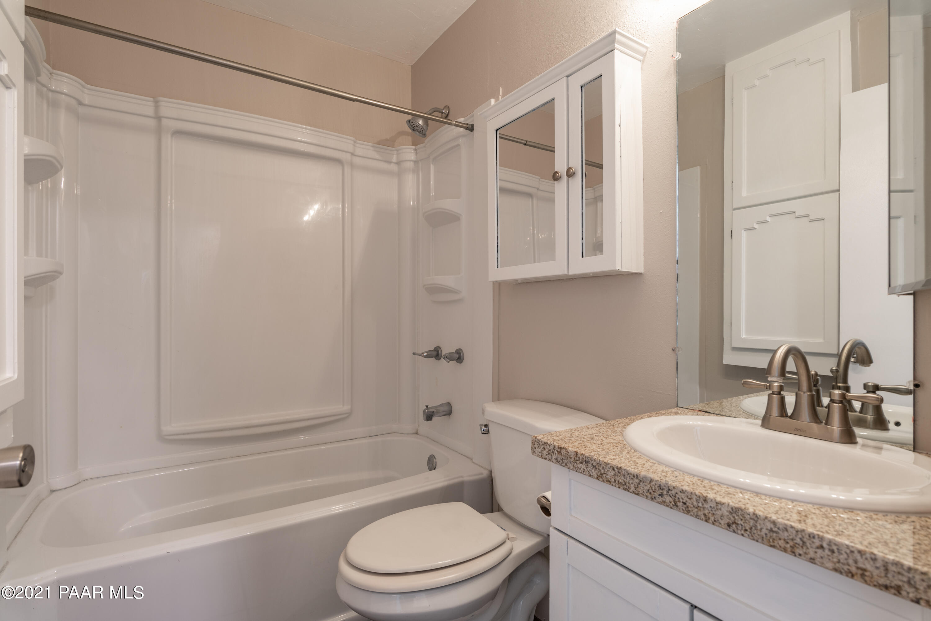 845 Sunset Avenue, Unit D Prescott, AZ 86305 - Photo 15 of 18 a bathroom with a granite countertop sink toilet and shower