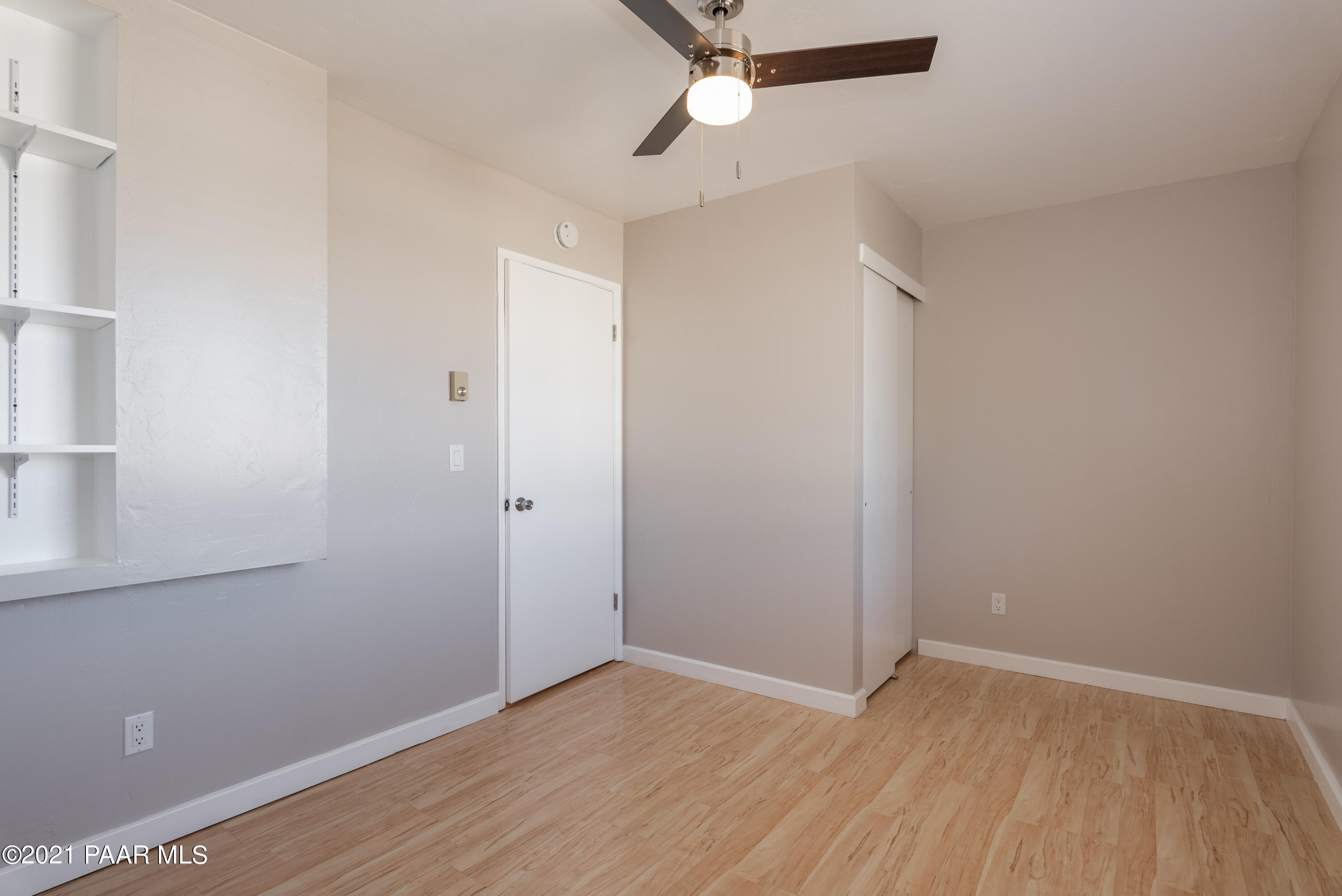 845 Sunset Avenue, Unit D Prescott, AZ 86305 - Photo 17 of 18 a view of an empty room with wooden floor
