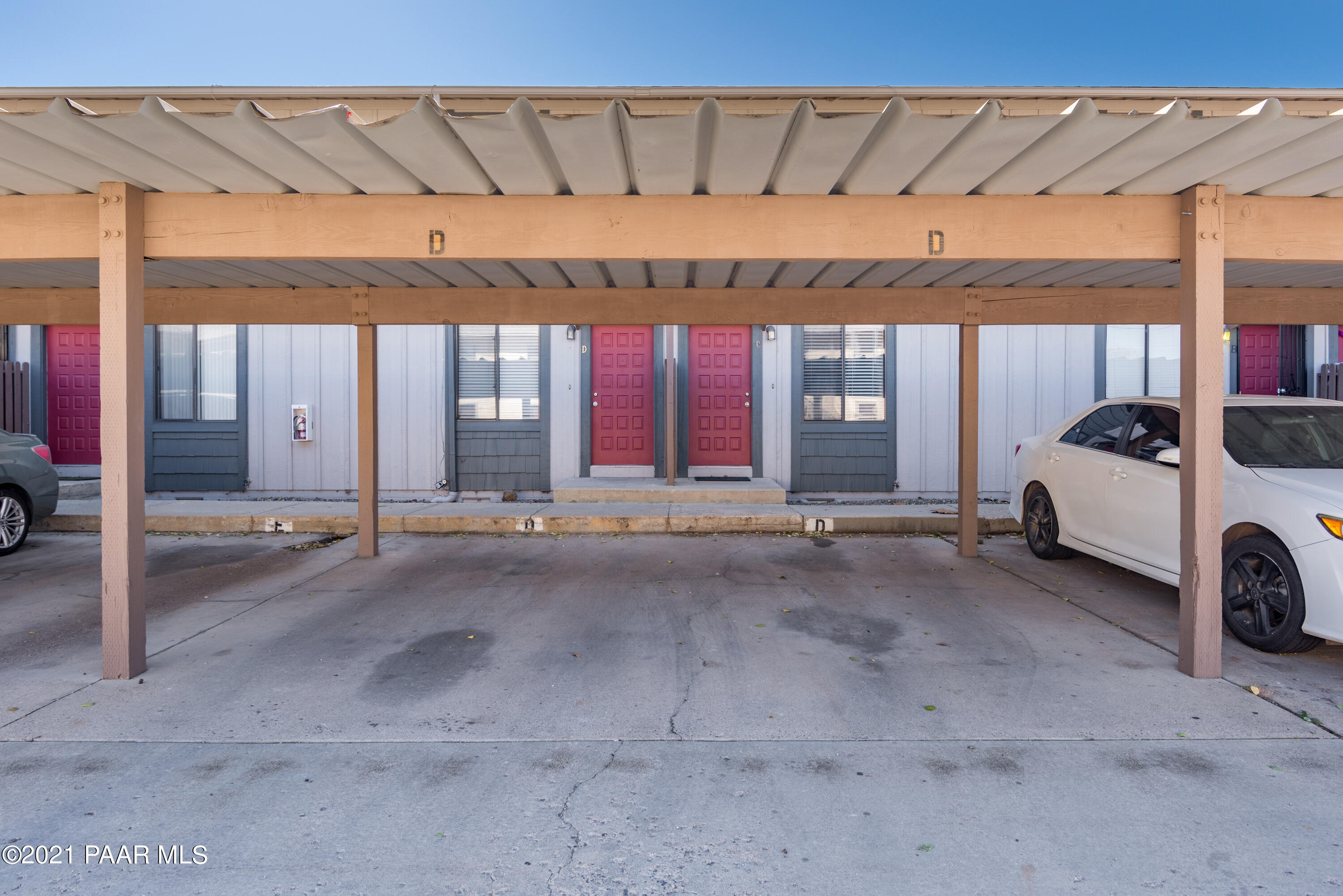 845 Sunset Avenue, Unit D Prescott, AZ 86305 - Photo 18 of 18 a view of a house with a couch and a garage