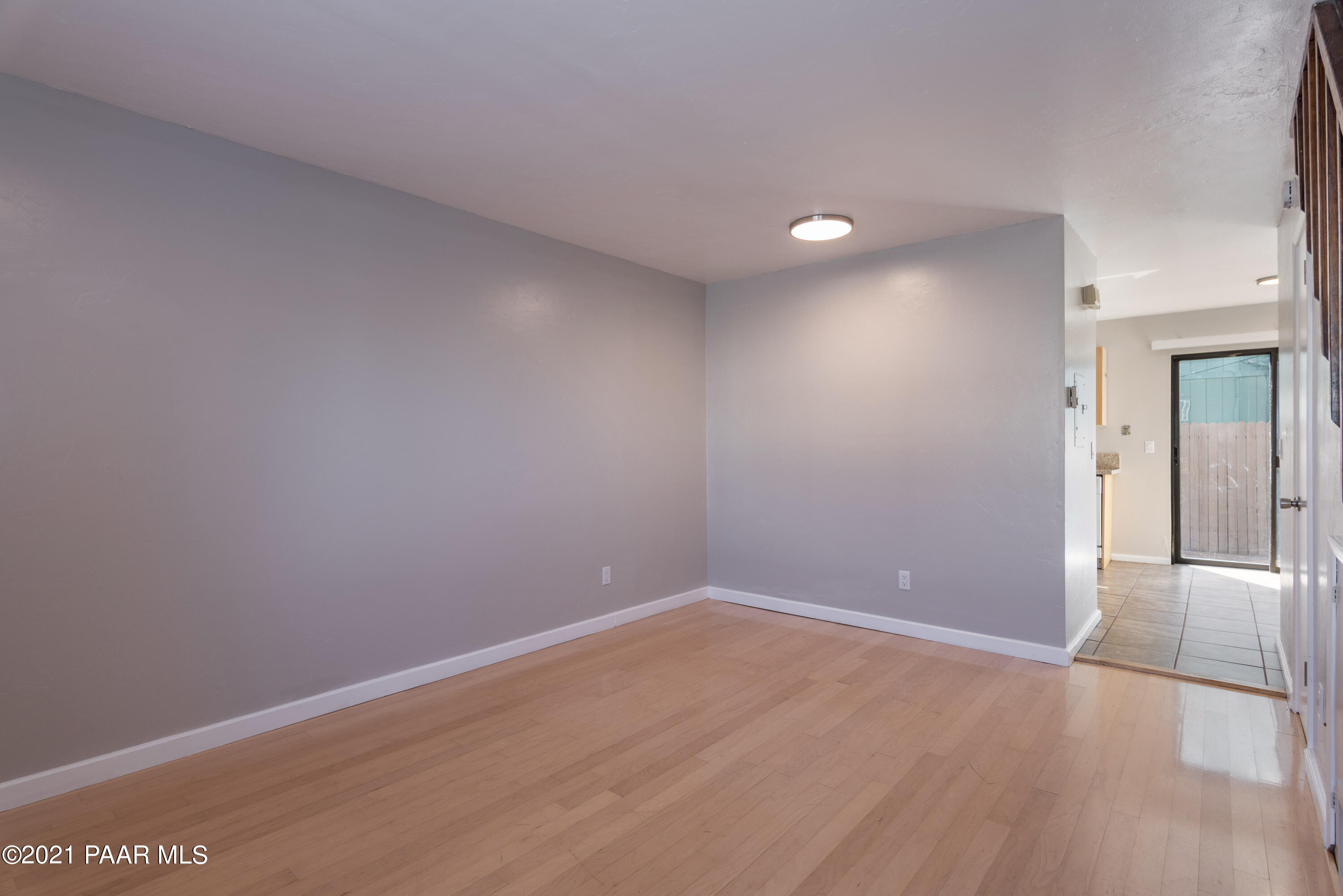 845 Sunset Avenue, Unit D Prescott, AZ 86305 - Photo 2 of 18 a view of an empty room with wooden floor