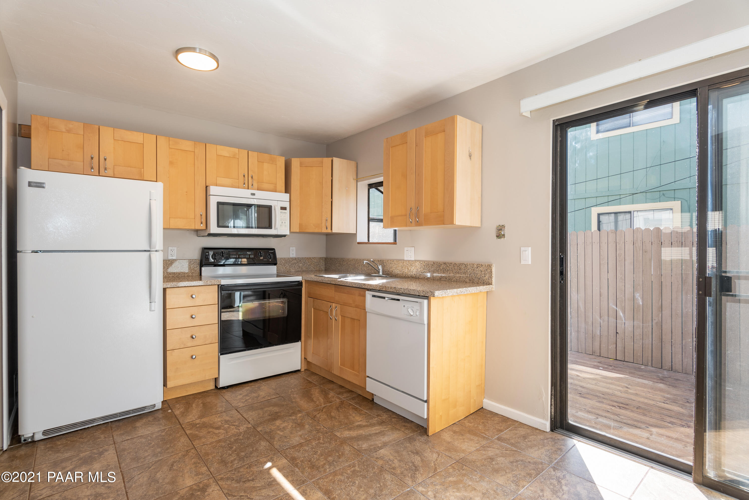 845 Sunset Avenue, Unit D Prescott, AZ 86305 - Photo 6 of 18 a kitchen with a refrigerator stove and sink