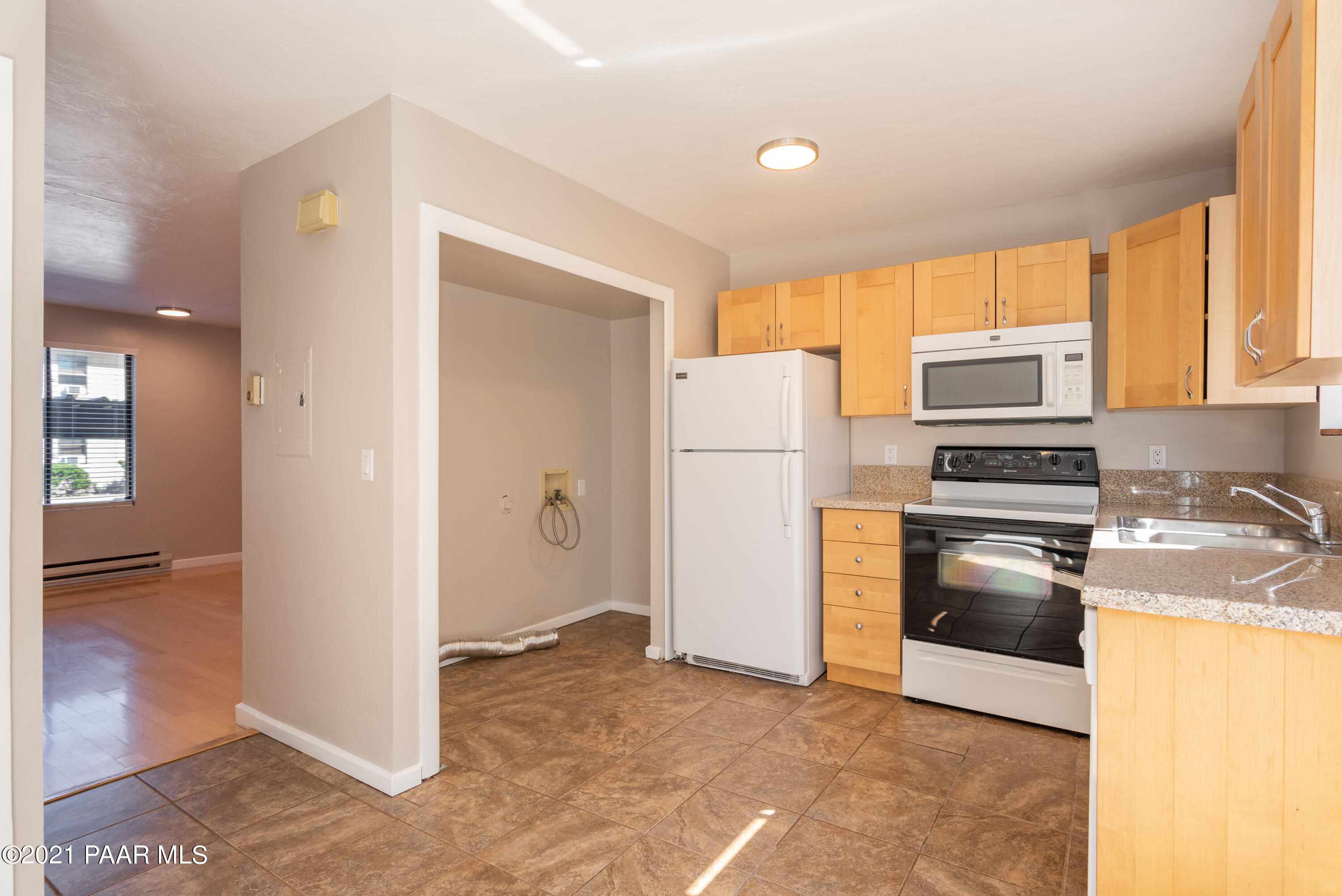 845 Sunset Avenue, Unit D Prescott, AZ 86305 - Photo 9 of 18 a kitchen with a refrigerator and a stove
