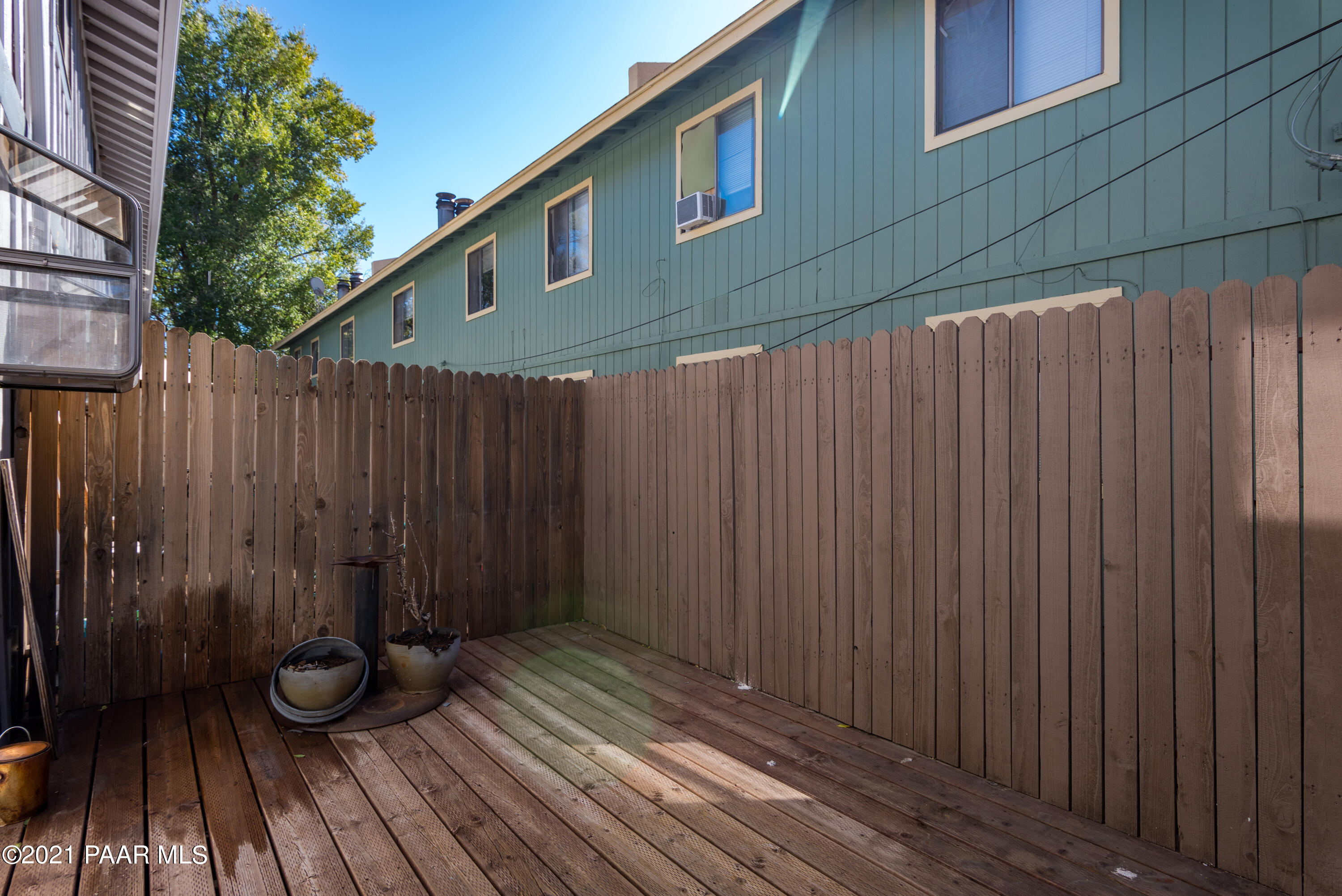 845 Sunset Avenue, Unit D Prescott, AZ 86305 - Photo 10 of 18 a view of a wooden door with a wooden fence
