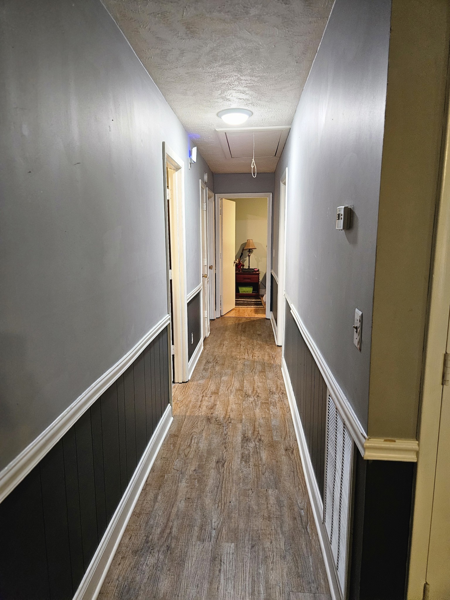 189 Sunset View Estill Springs, TN 37330 - Photo 14 of 22 a view of a hallway with wooden floor and staircase