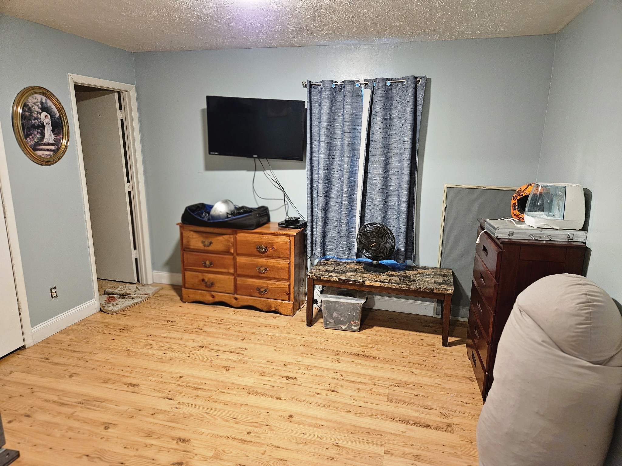 189 Sunset View Estill Springs, TN 37330 - Photo 16 of 22 a bedroom with a bed and a flat screen tv