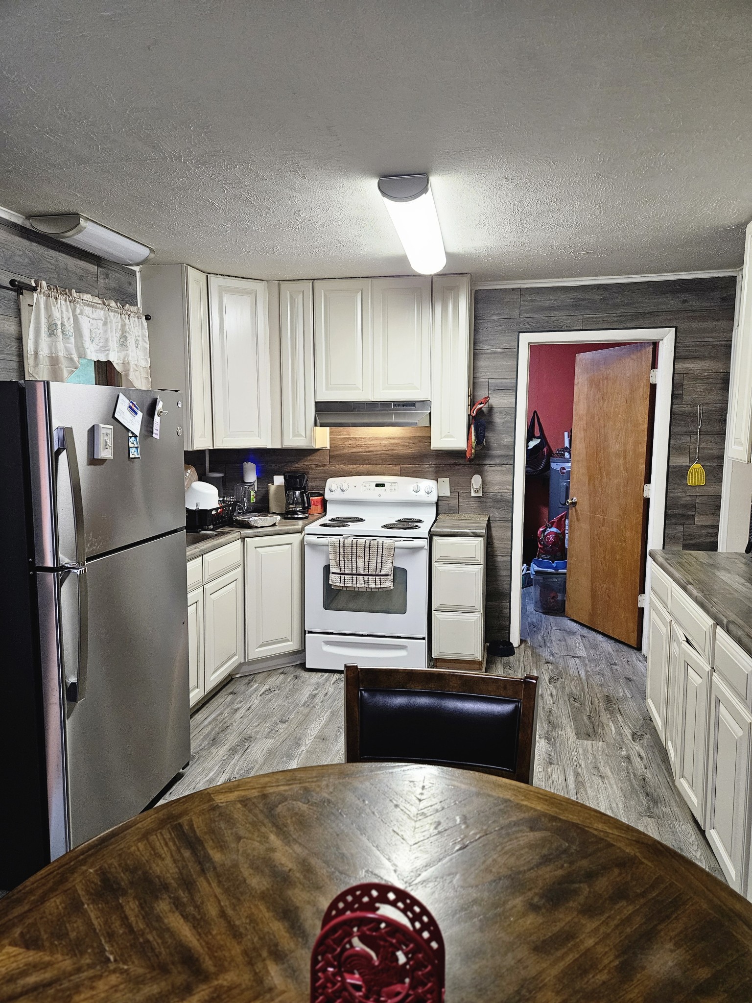 189 Sunset View Estill Springs, TN 37330 - Photo 7 of 22 a kitchen with stainless steel appliances granite countertop a refrigerator sink and stove