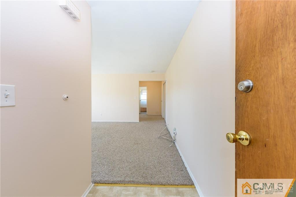 48 Stonehurst Boulevard, Unit E Freehold, NJ 07728 - Photo 4 of 15 a view of a hallway with closet