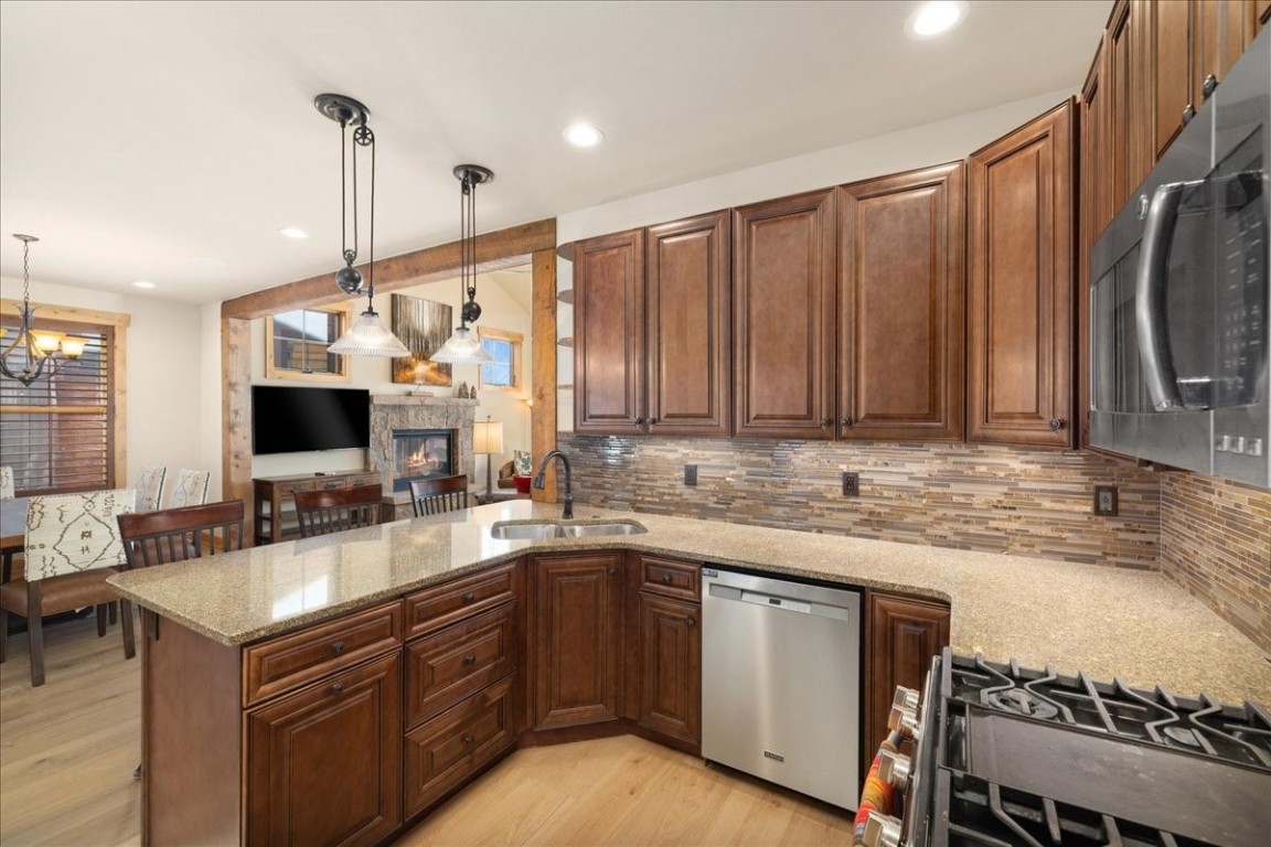 403 Fly Line Drive Silverthorne, CO 80498 - Photo 12 of 35 a kitchen with a sink and a stove top oven