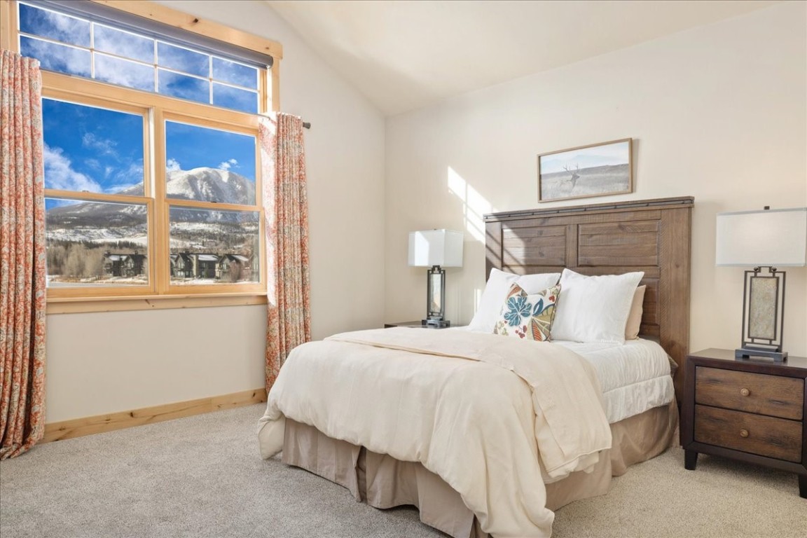 403 Fly Line Drive Silverthorne, CO 80498 - Photo 15 of 35 a bedroom with a bed lamp and a large window