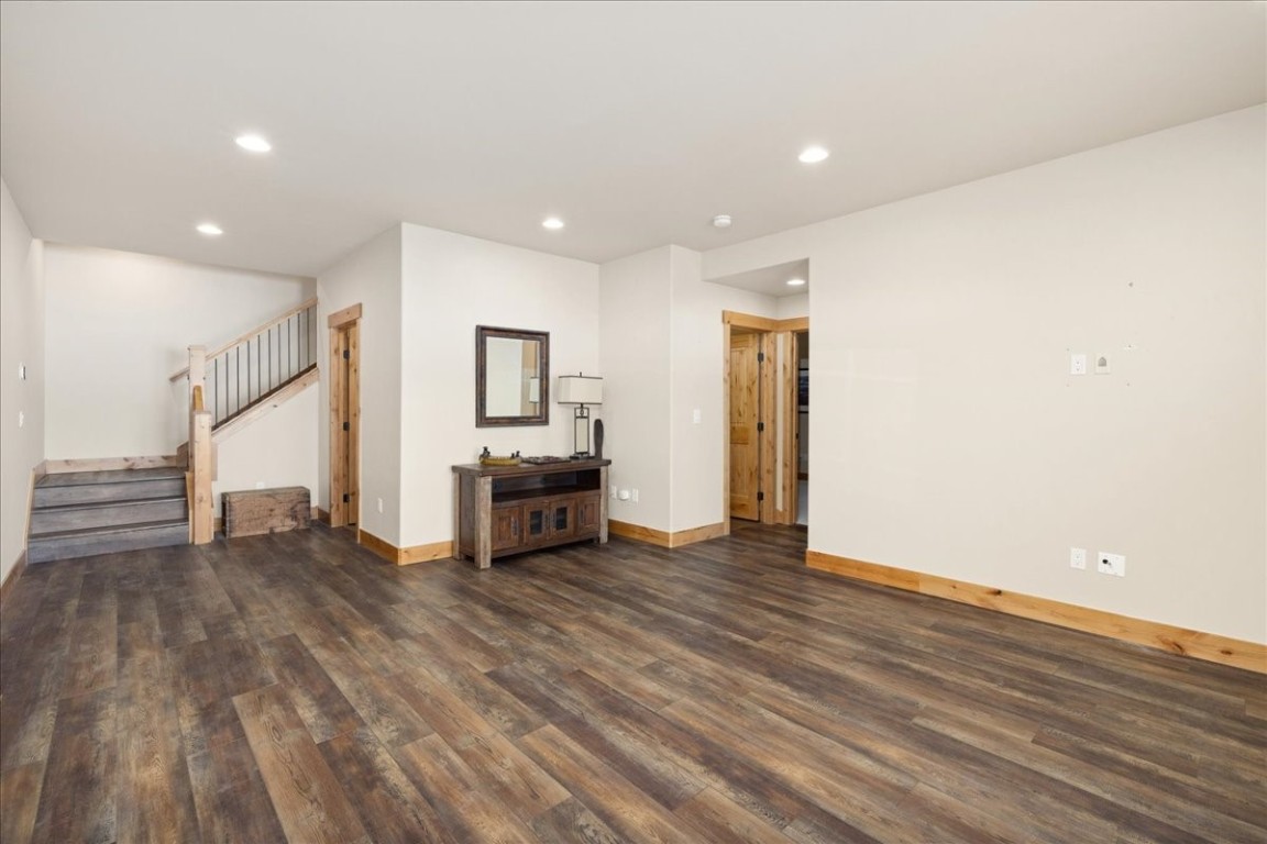 403 Fly Line Drive Silverthorne, CO 80498 - Photo 20 of 35 a view of an empty room with wooden floor kitchen and a window