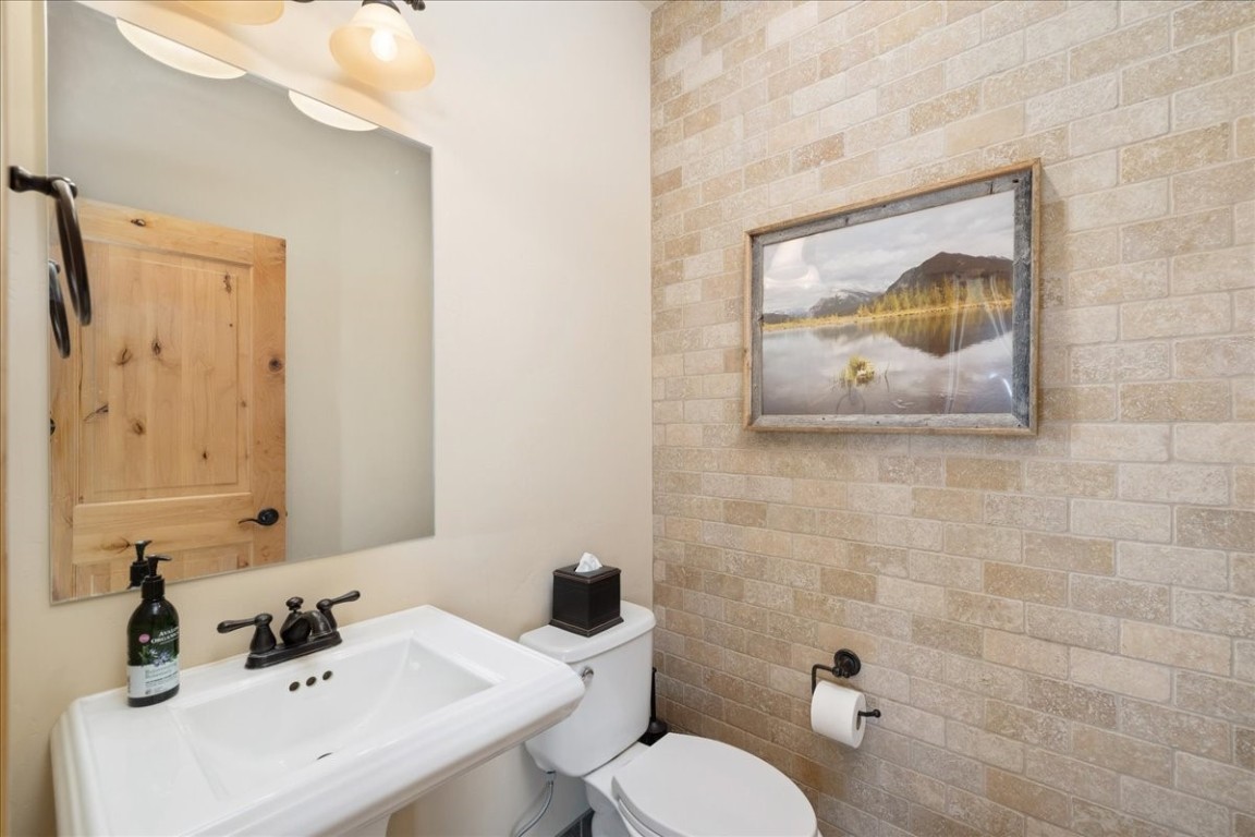 403 Fly Line Drive Silverthorne, CO 80498 - Photo 23 of 35 a bathroom with a sink mirror and toilet