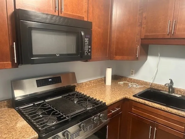 a kitchen with a stove and a microwave