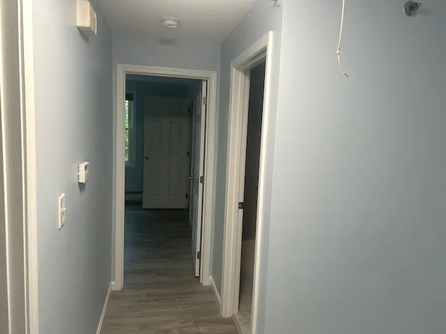 a view of a bathroom from a hallway