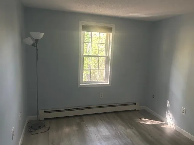 an empty room with a empty space and a window