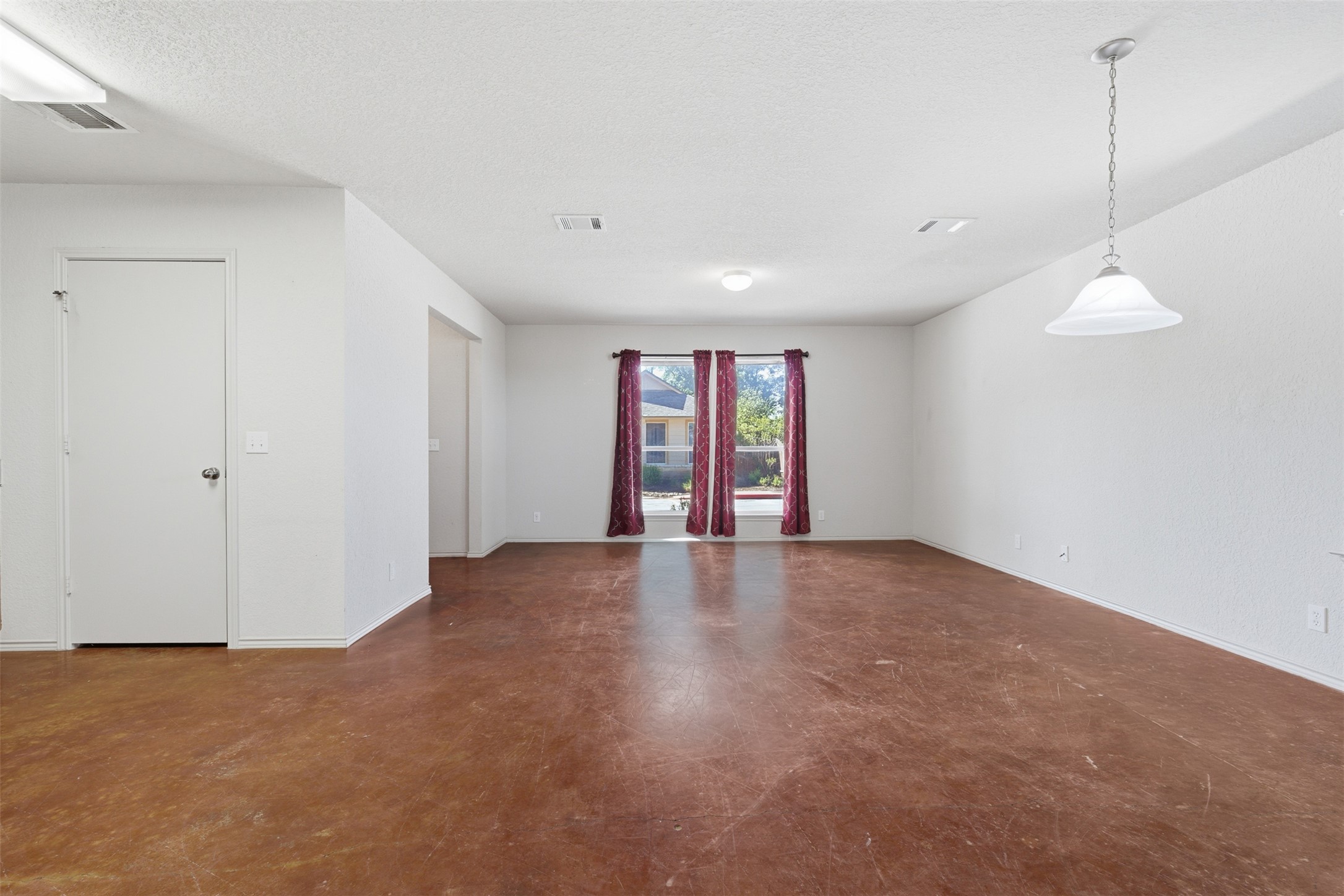 4529 Secure Lane, Unit 31 Austin, TX 78725 - Photo 6 of 38 a view of an empty room with a window