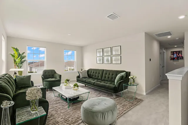 a living room with furniture and a rug