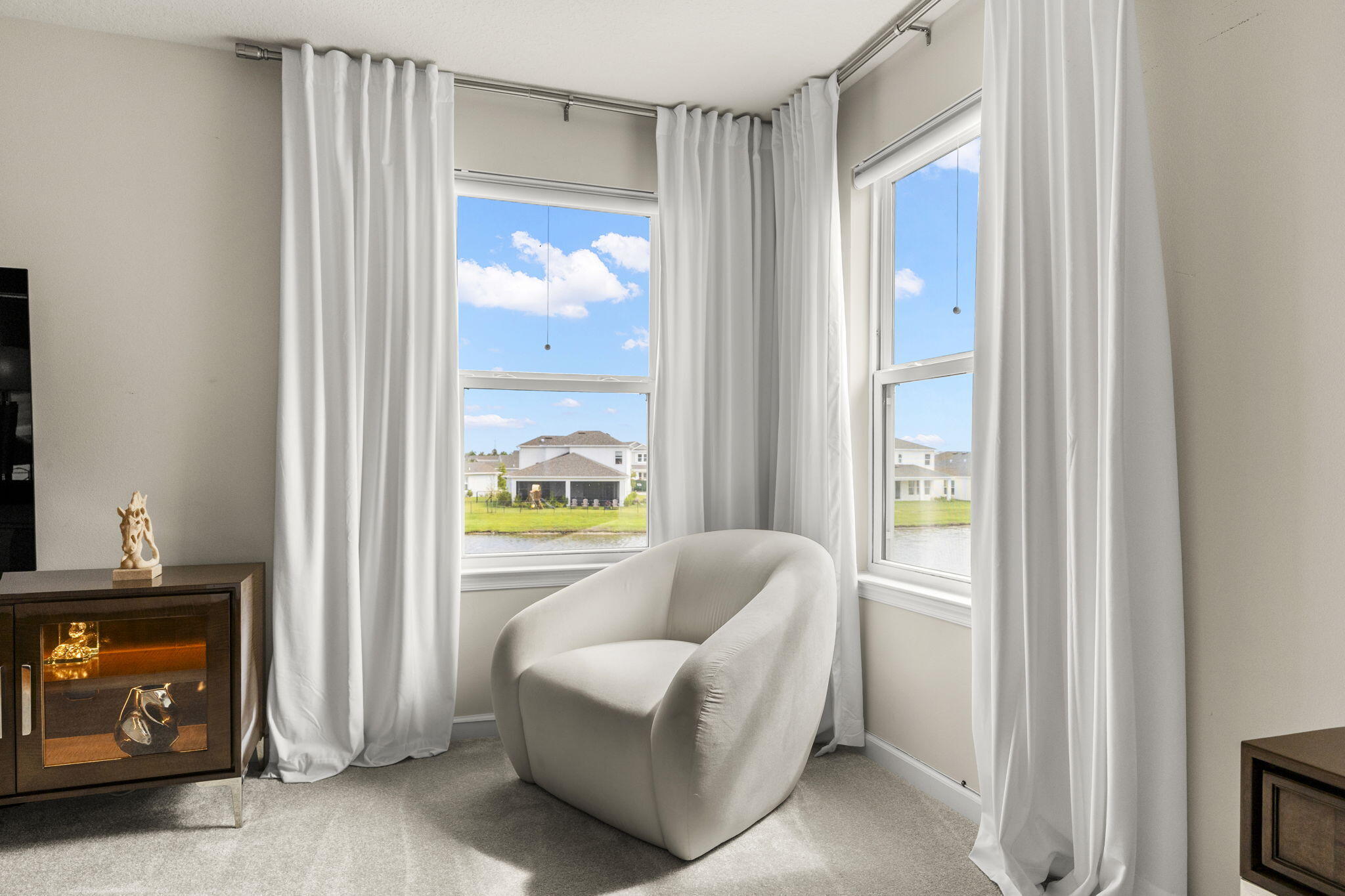 12291 Southwest Forli Way Port Port St. Lucie, FL 34987 - Photo 24 of 48 a living room with furniture and a window