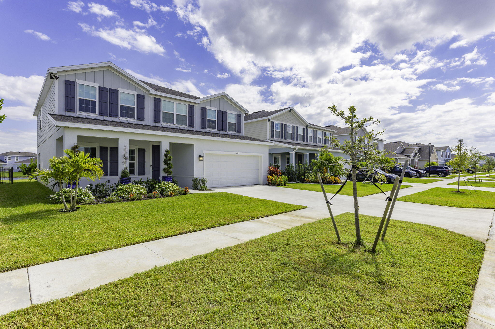 12291 Southwest Forli Way Port Port St. Lucie, FL 34987 - Photo 3 of 48 a house view with a garden space