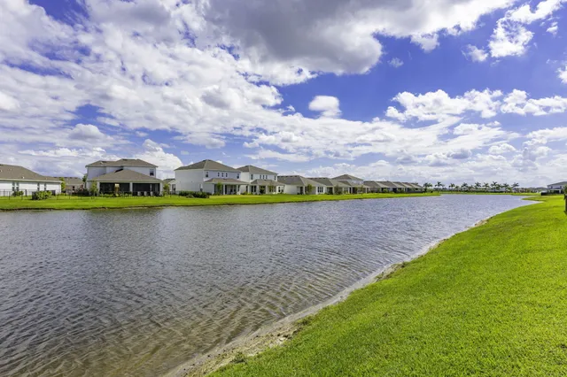 a view of a lake with a big yard