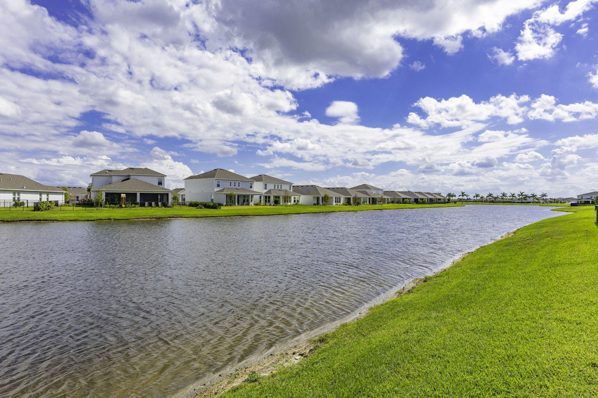 12291 Southwest Forli Way Port Port St. Lucie, FL 34987 - Photo 34 of 48 a view of a lake with a big yard