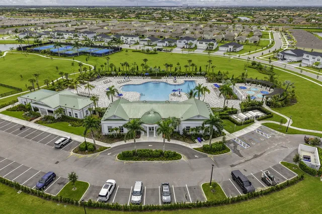 an aerial view of residential house with outdoor space and river