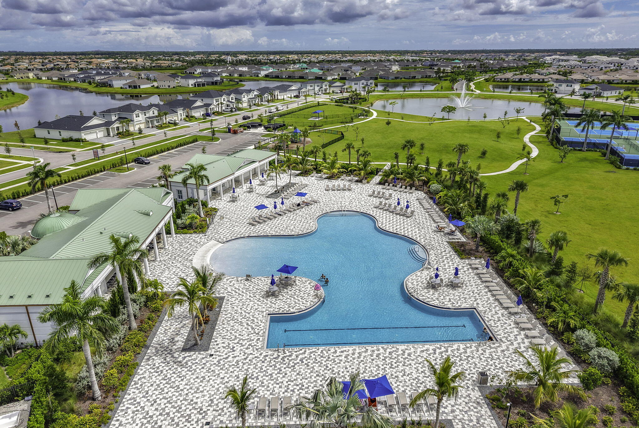 12291 Southwest Forli Way Port Port St. Lucie, FL 34987 - Photo 42 of 48 a view of a swimming pool and outdoor seating