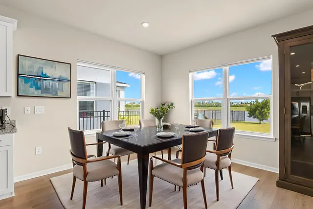 a dining room with furniture and window