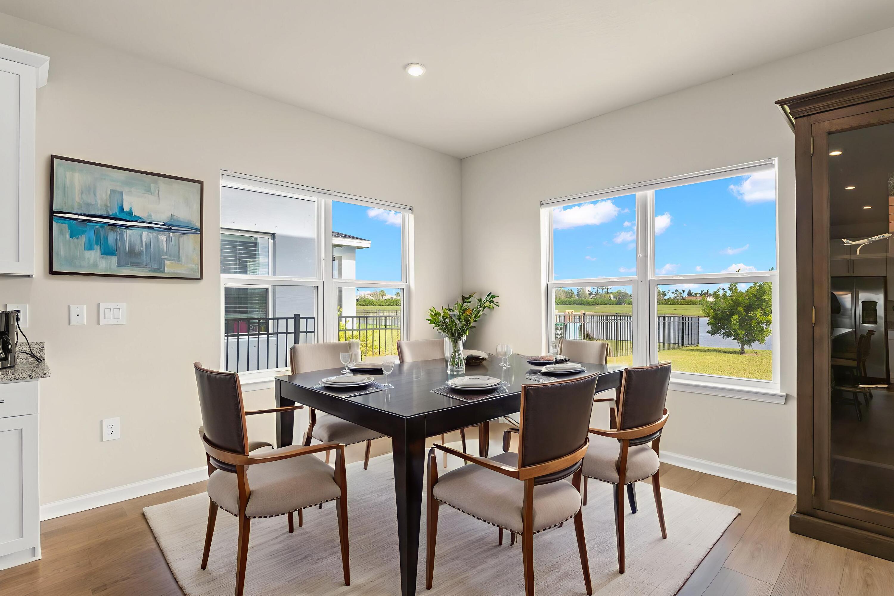 12291 Southwest Forli Way Port Port St. Lucie, FL 34987 - Photo 9 of 48 a dining room with furniture and window