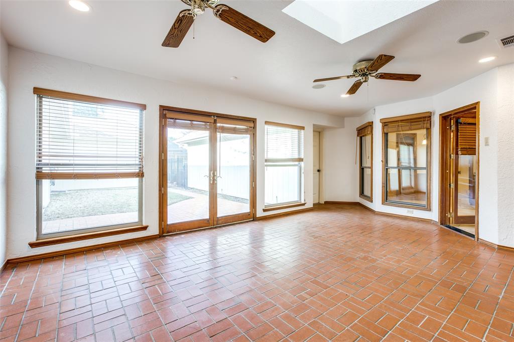 3202 Ridge Oak Drive Garland, TX 75044 - Photo 12 of 25 a view of an empty room with a window and wooden floor