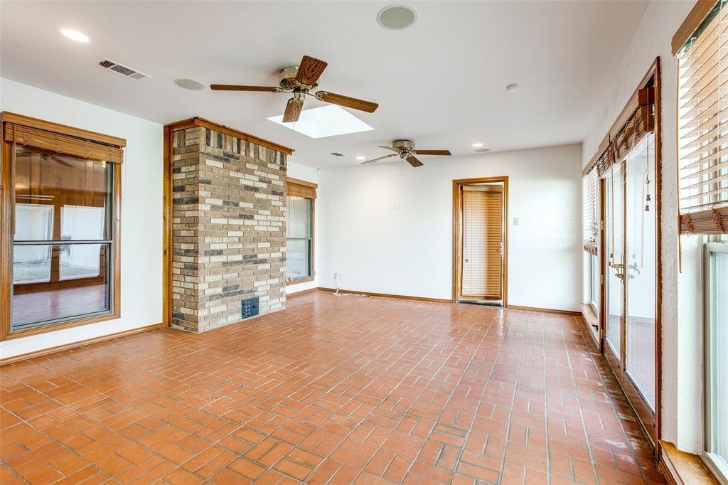 3202 Ridge Oak Drive Garland, TX 75044 - Photo 13 of 25 a view of an empty room with a window and wooden floor