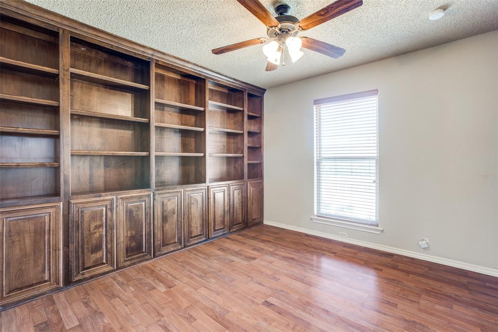 3202 Ridge Oak Drive Garland, TX 75044 - Photo 14 of 25 a view of an empty room with a window and wooden floor
