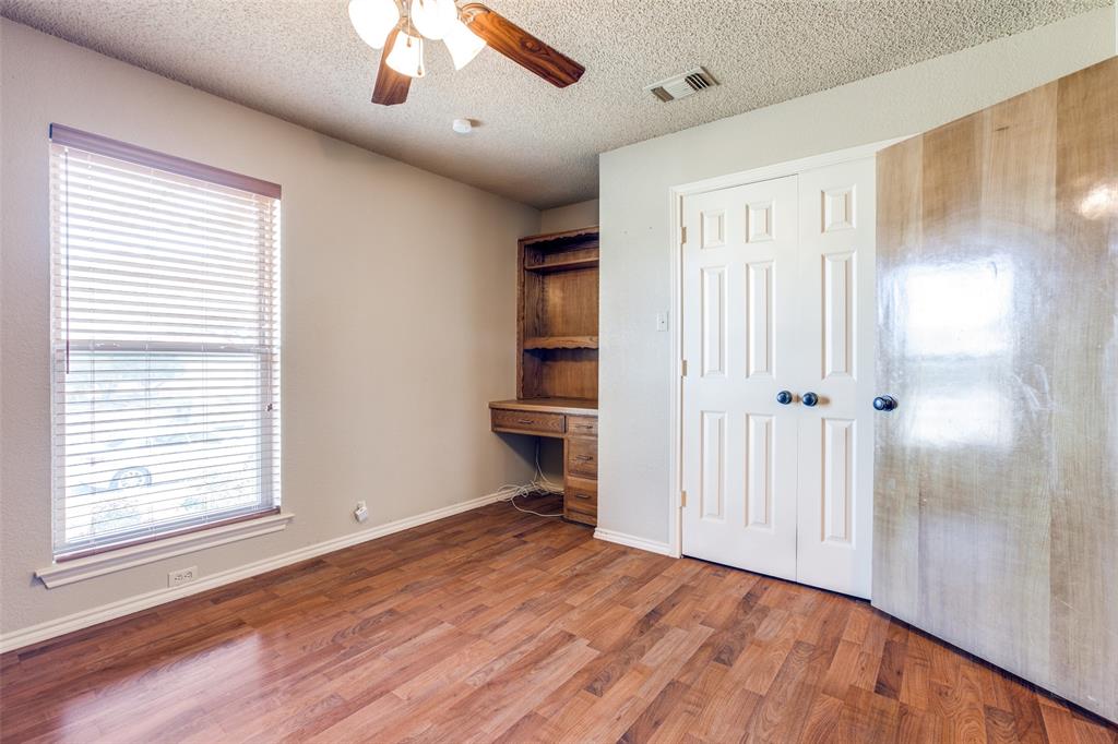 3202 Ridge Oak Drive Garland, TX 75044 - Photo 15 of 25 a view of empty room with wooden floor and fan