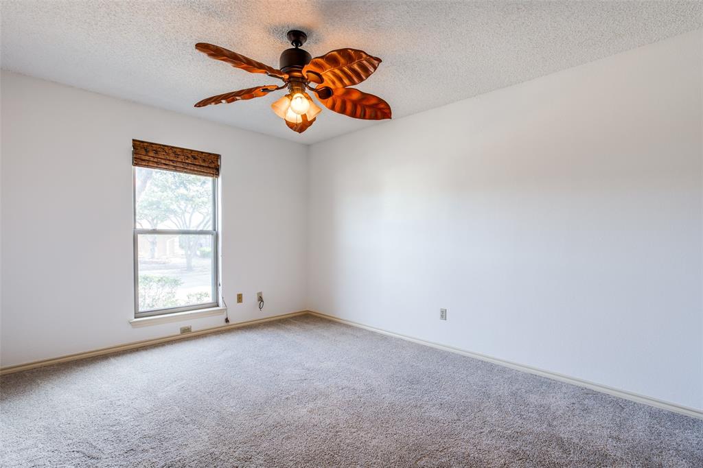 3202 Ridge Oak Drive Garland, TX 75044 - Photo 16 of 25 an empty room with windows and natural light