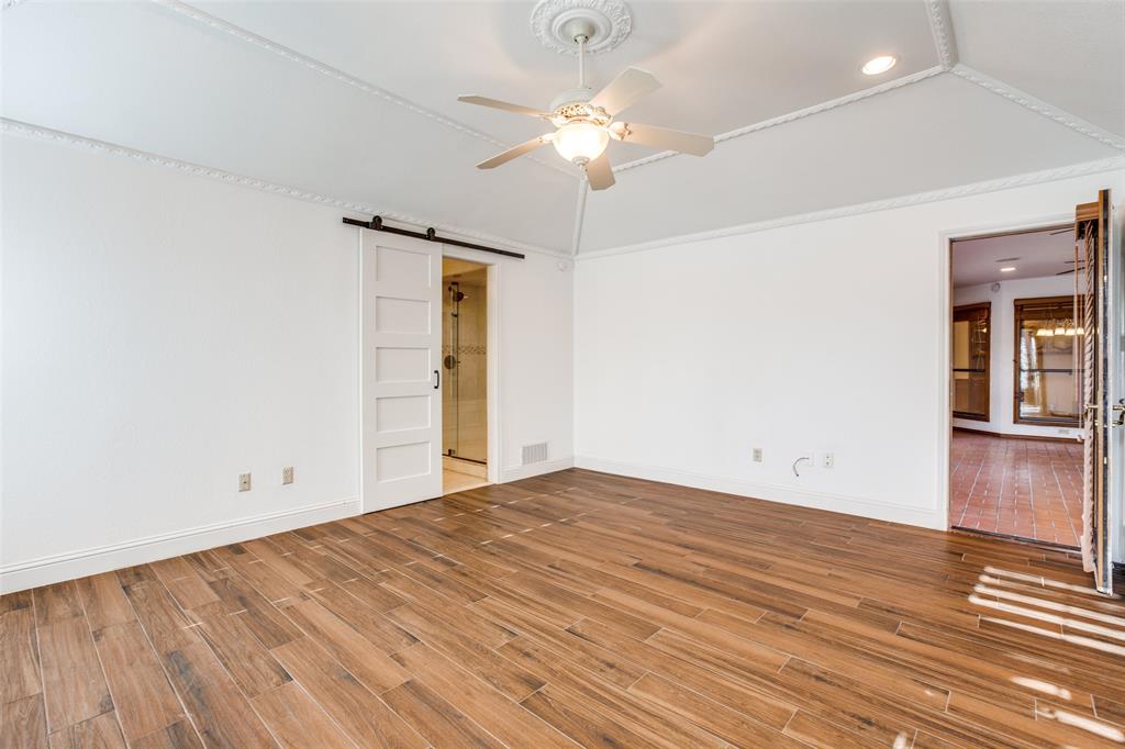 3202 Ridge Oak Drive Garland, TX 75044 - Photo 20 of 25 wooden floor in an empty room with a window