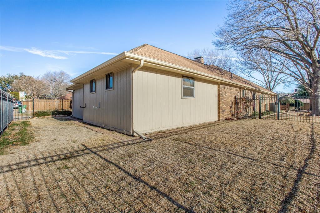 3202 Ridge Oak Drive Garland, TX 75044 - Photo 23 of 25 a view of a house with a yard
