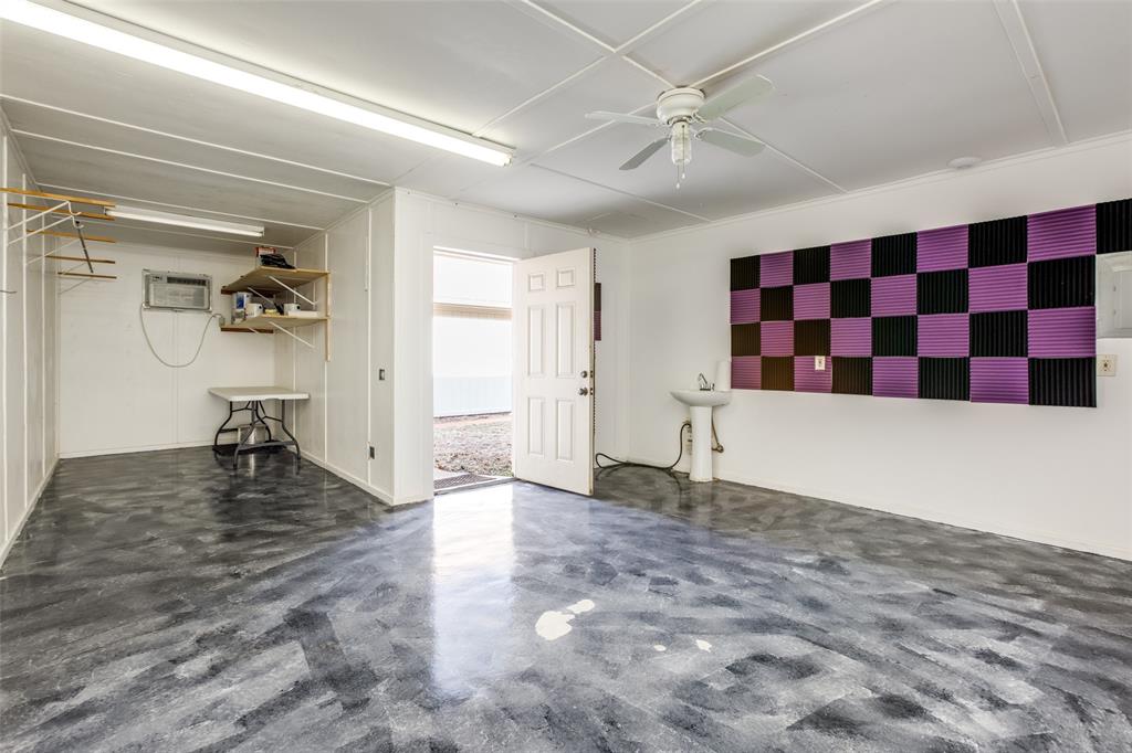 3202 Ridge Oak Drive Garland, TX 75044 - Photo 25 of 25 a view of a livingroom with wooden floor and a ceiling fan