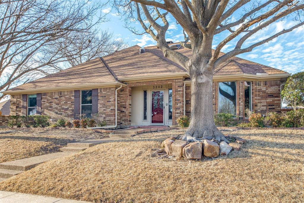 3202 Ridge Oak Drive Garland, TX 75044 - Photo 3 of 25 a front view of a house