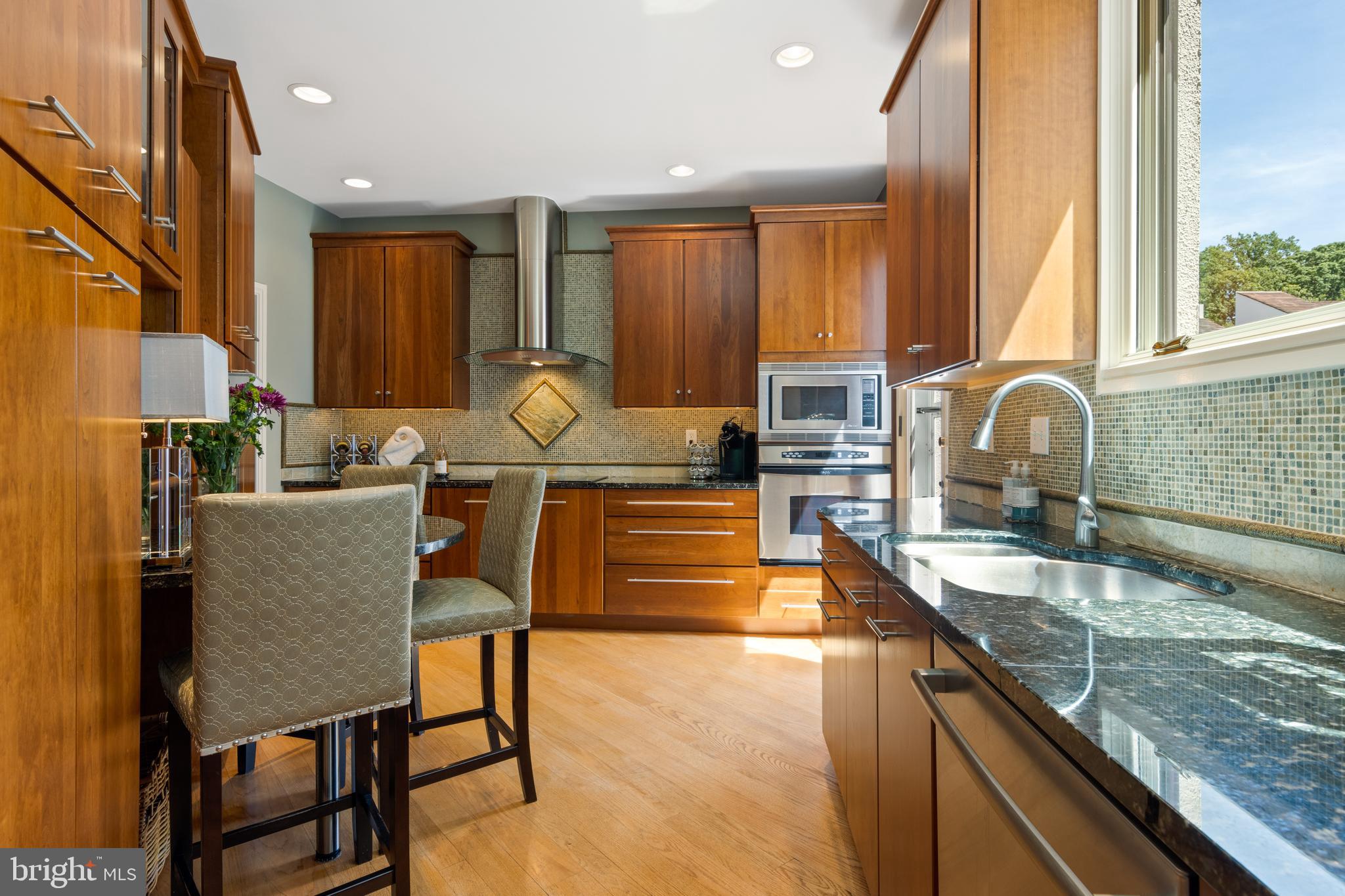 4 Brettagne, Unit 4 Devon, PA 19333 - Photo 12 of 26 a kitchen with granite countertop a sink and cabinets