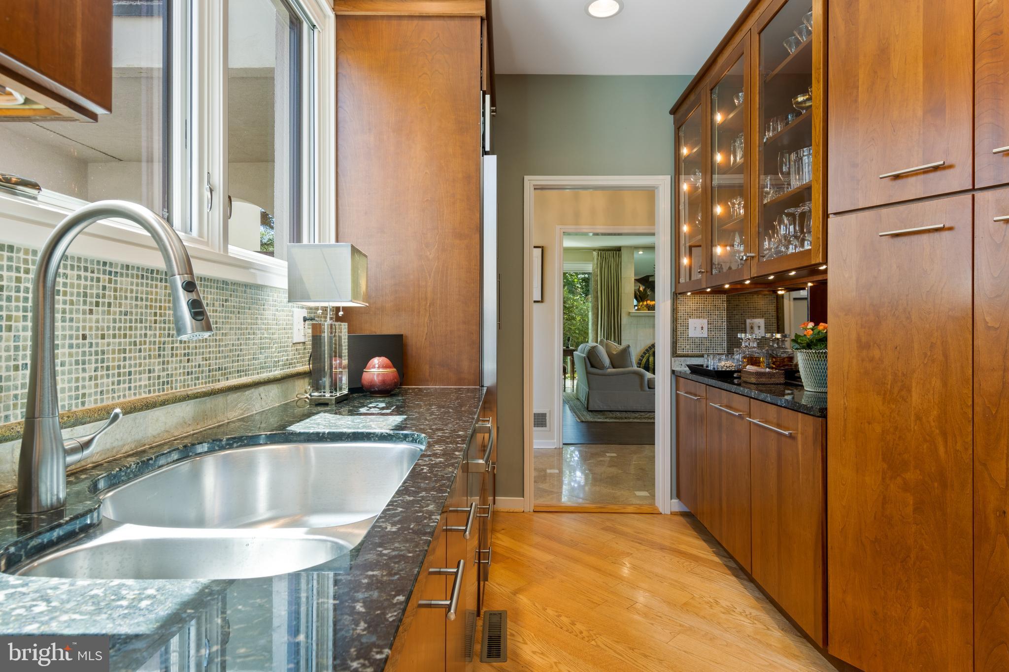 4 Brettagne, Unit 4 Devon, PA 19333 - Photo 13 of 26 a kitchen with kitchen island granite countertop a sink and a refrigerator