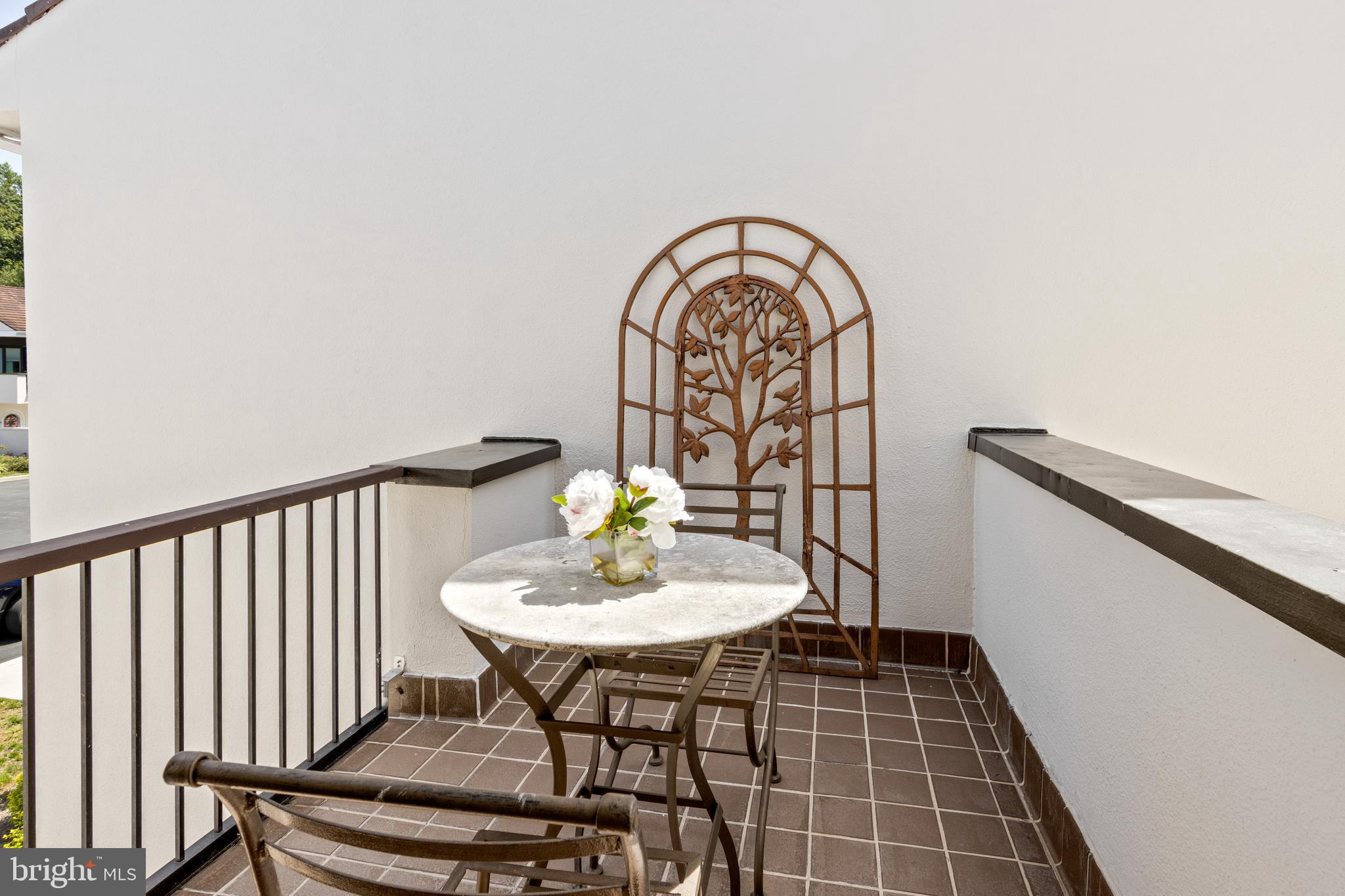 4 Brettagne, Unit 4 Devon, PA 19333 - Photo 17 of 26 a view of a dining room with furniture and wooden floor