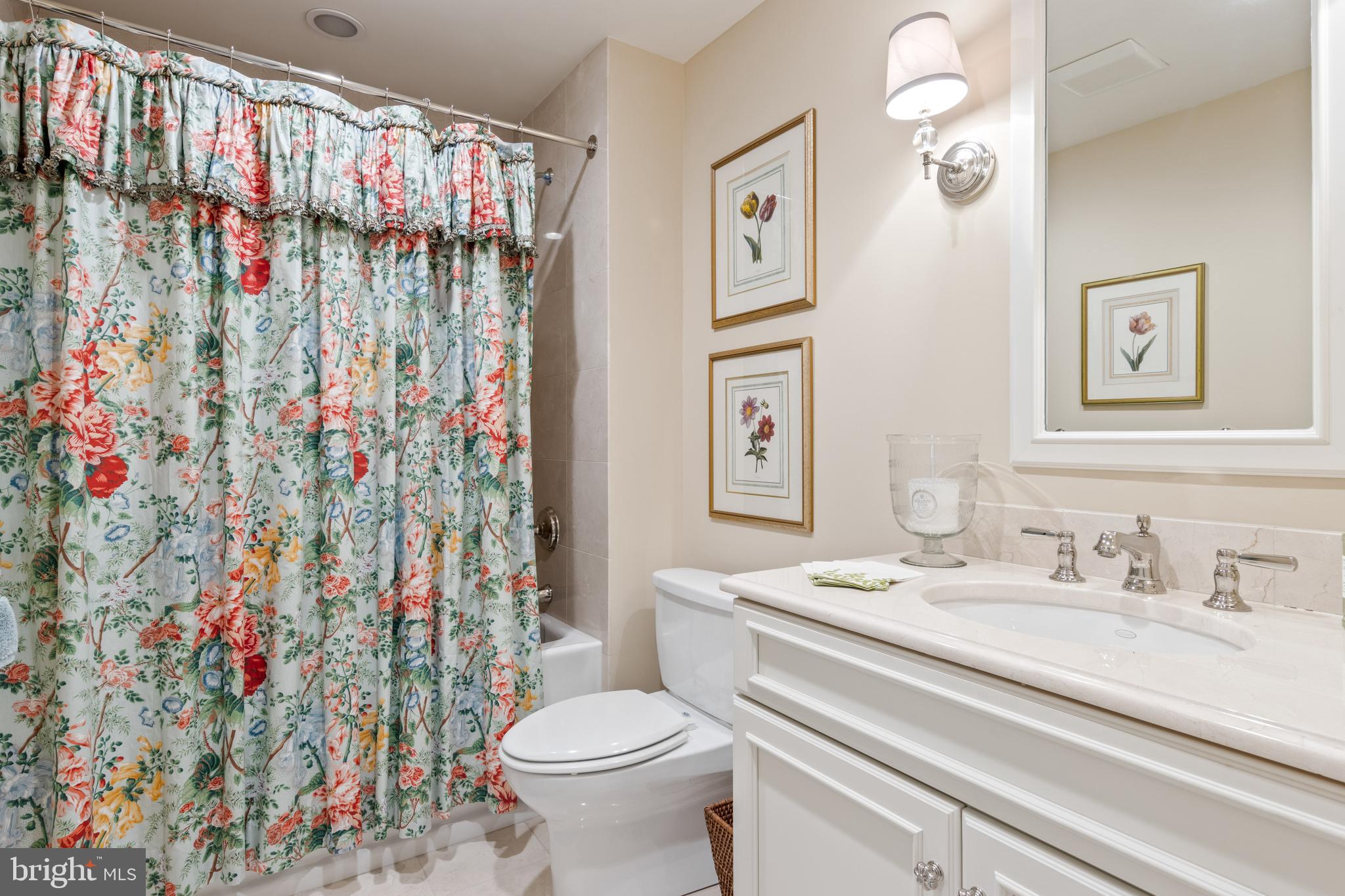 4 Brettagne, Unit 4 Devon, PA 19333 - Photo 21 of 26 a bathroom with a sink toilet and shower